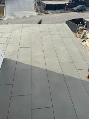 Gray coated deck with herringbone pattern pavers and uniform finish