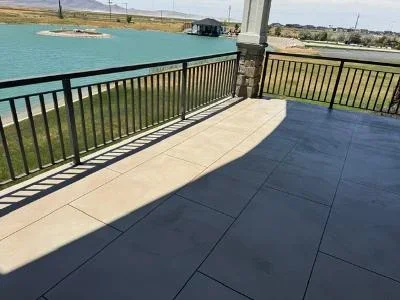 Dark coated composite deck with aluminum railing overlooking water