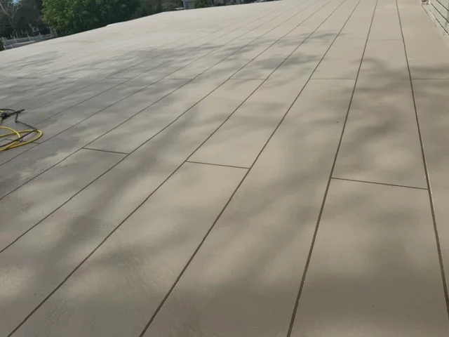 Gray deck coating with linear joints on large residential deck surface