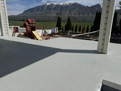 Light gray deck coating applied to residential deck with mountain view